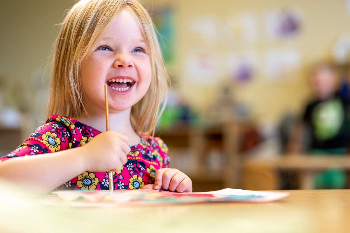 Girl at Desk with Pencil