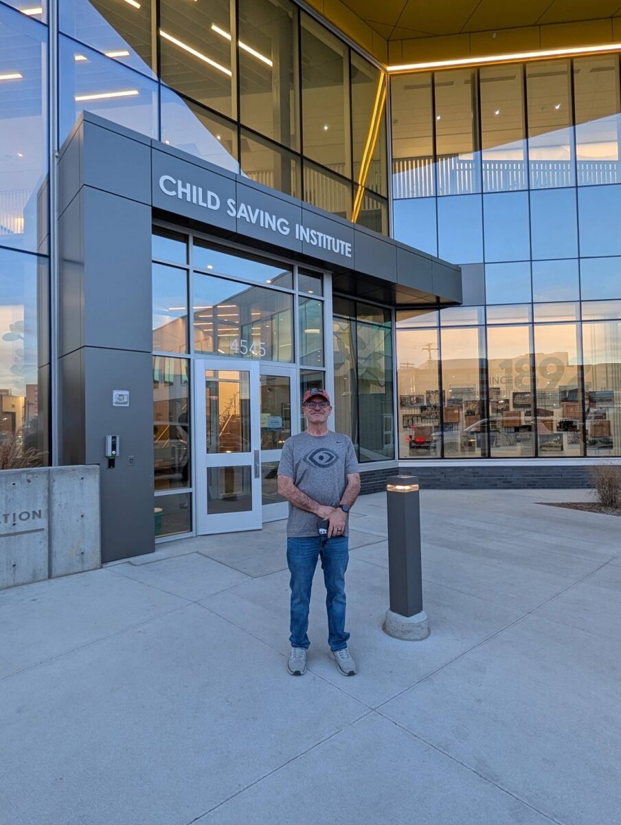 John Schneider outside of Child Saving Institute