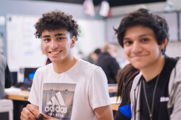 Two teenage boys smiling