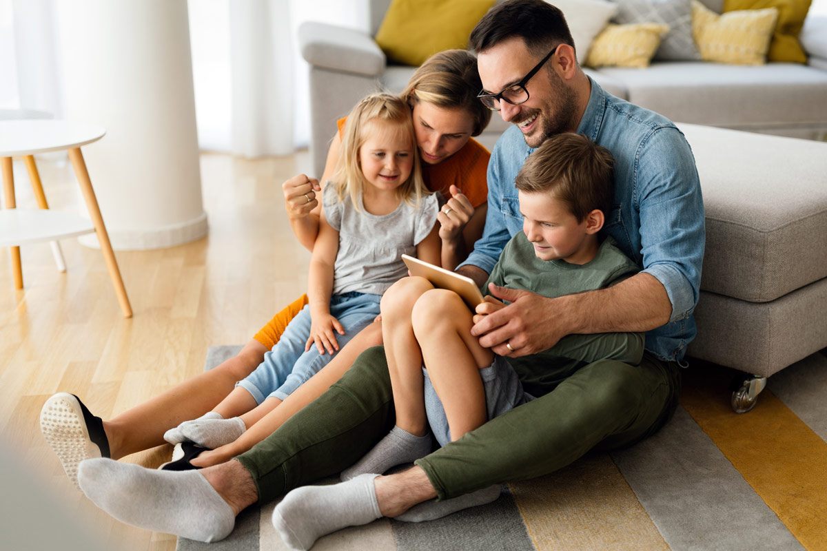 Family sharing a tablet device