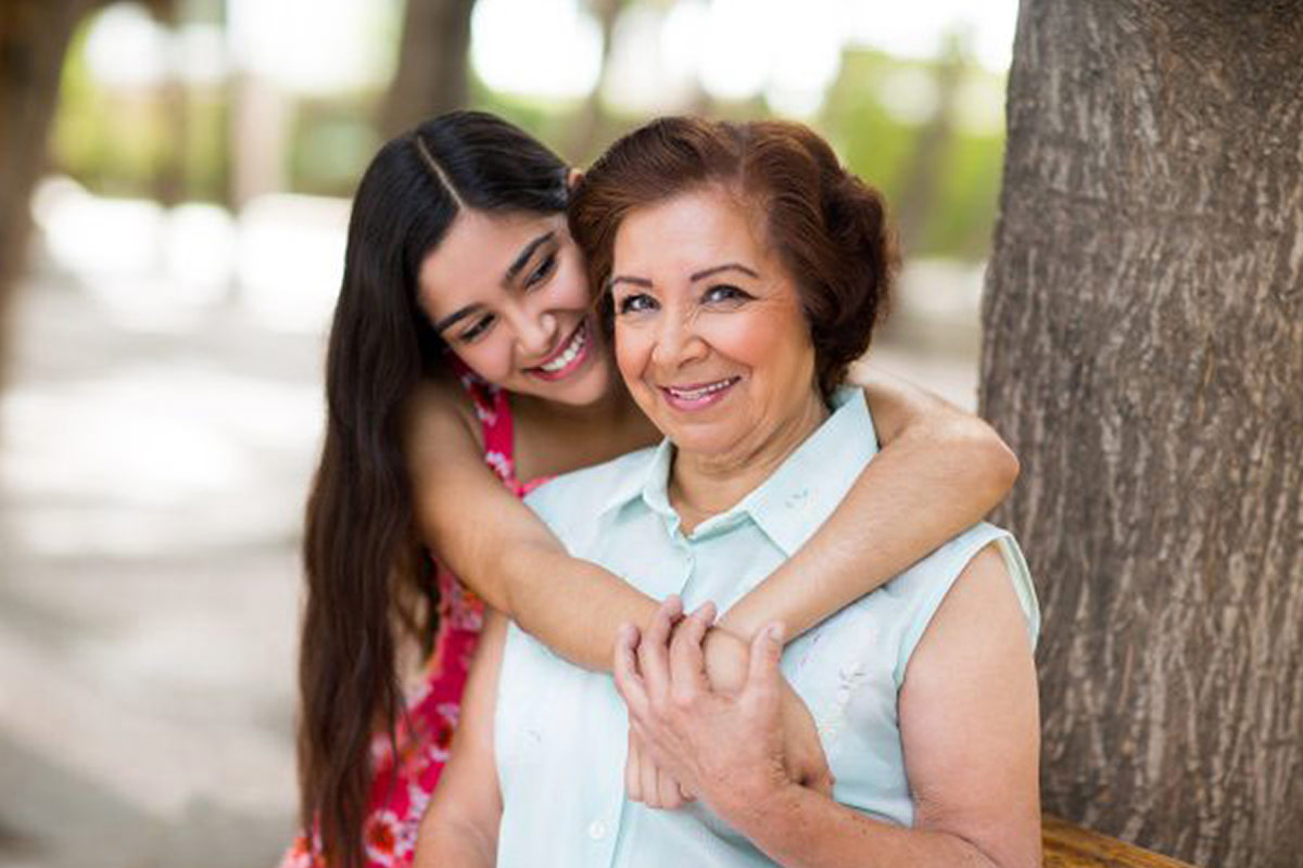 Teenager hugging her grandma
